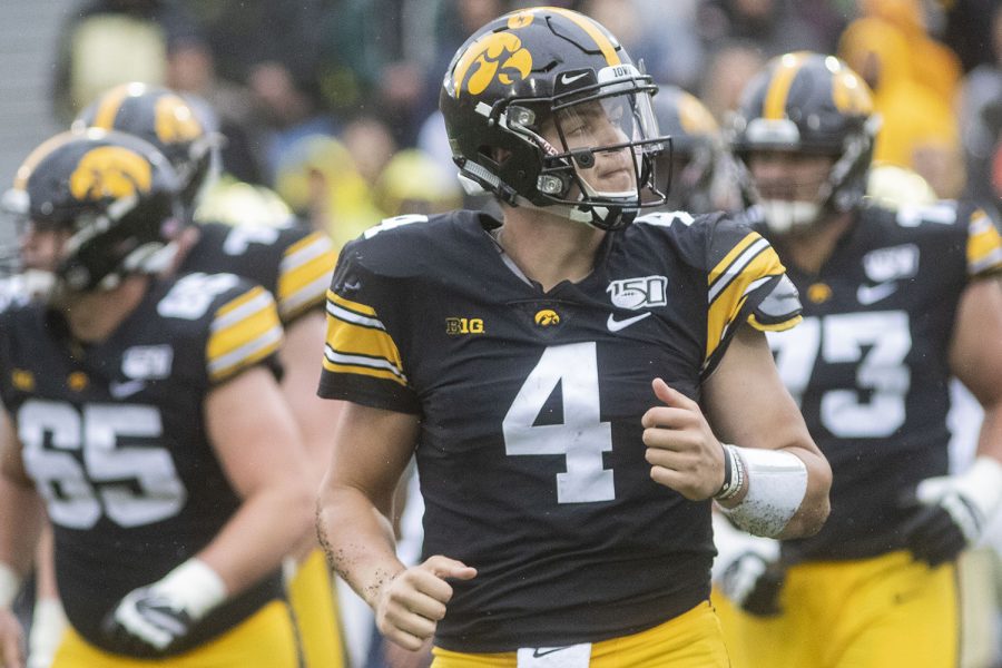 Iowa quarterback Nate Stanley looks up at the scoreboard on his way off the field during the Iowa football game against Purdue at Kinnick Stadium on Saturday, Oct. 19, 2019. The Hawkeyes defeated the Boilermakers 26-20.