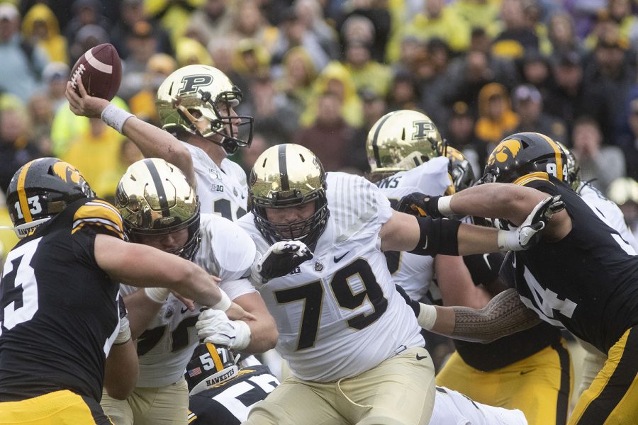 Purdue quarterback Jack Plummer looks for an open teammate during the Iowa football game against Purdue at Kinnick Stadium on Saturday, Oct. 19, 2019. The Hawkeyes defeated the Boilermakers 26-20.