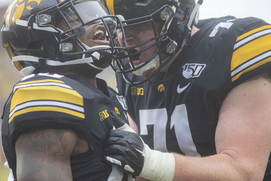 Iowa running back Mekhi Sargent and offensive lineman Mark Kallenberger celebrate Sargent’s touchdown during the fourth quarter of the Iowa football game against Purdue at Kinnick Stadium on Saturday, Oct. 19, 2019. The Hawkeyes defeated the Boilermakers 26-20.