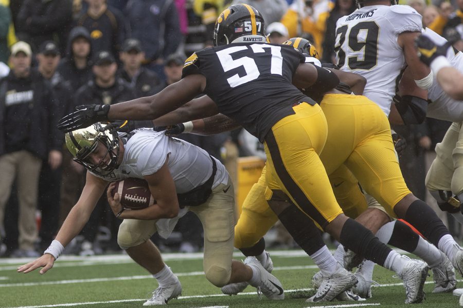 Purdue quarterback Jack Plummer fails to dodge Iowa’s defense during the Iowa football game against Purdue at Kinnick Stadium on Saturday, Oct. 19, 2019. The Hawkeyes defeated the Boilermakers 26-20. 