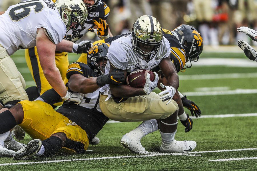 Purdue running back King Doerue attempts to break through Iowa players during the Iowa football game against Purdue at Kinnick Stadium on Saturday, Oct. 19, 2019. The Hawkeyes defeated the Boilermakers 26-20. Doerue had 10 carries throughout the game.