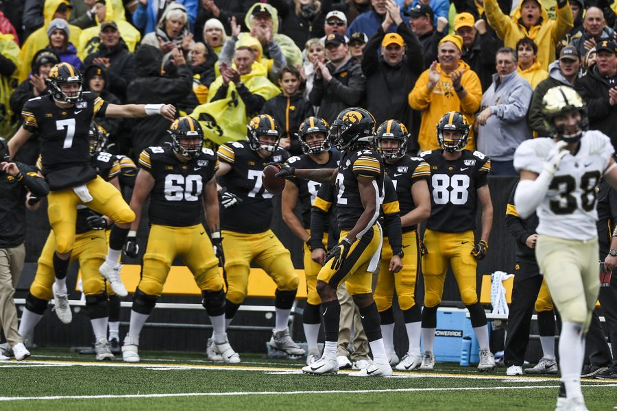 Iowa players react to wide receiver Brandon Smiths catch during the Iowa football game against Purdue at Kinnick Stadium on Saturday, Oct. 19, 2019. The Hawkeyes defeated the Boilermakers 26-20.