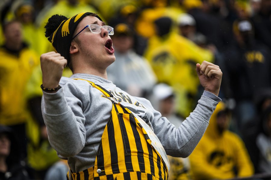 An Iowa fan cheers during the Iowa football game against Purdue at Kinnick Stadium on Saturday, Oct. 19, 2019. The Hawkeyes defeated the Boilermakers 26-20.