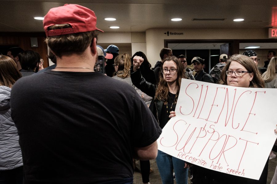 Protestors stand in silence as audience members exit the venue following the Culture War tour at the Iowa Memorial Union on Wednesday, October 23, 2019. Culture War will stop at eight different Turning Point USA chapters on college campuses across the country. 