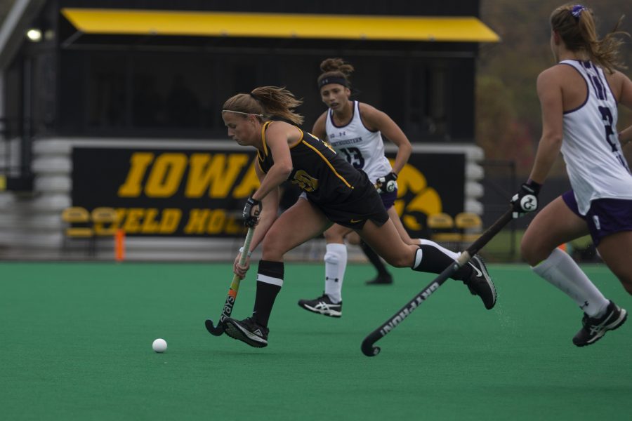 Iowa midfielder Sophie Sunderland runs up the field during a field hockey game between Iowa and Northwestern at Grant Field on Saturday Oct. 26, 2019. The Hawkeyes defeated the Wildcats 2-1.