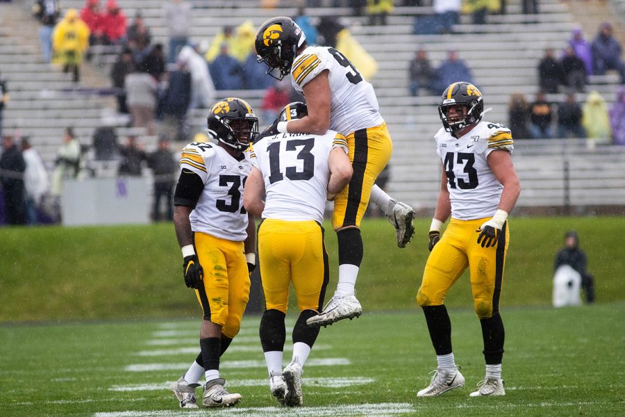 Iowa players celebrate during a game against Northwestern at Ryan Field on Saturday, October 26, 2019. The Hawkeyes defeated the Wildcats 20-0. Evans had a total of 2 tackles. 
