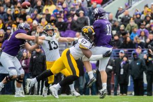Iowa defensive end Chauncey Golston tackles Northwestern quarter back Aidan Smith during a game against Northwestern at Ryan Field on Saturday, October 26, 2019. The Hawkeyes defeated the Wildcats 20-0. The Hawkeyes had a total of 63 tackles. 