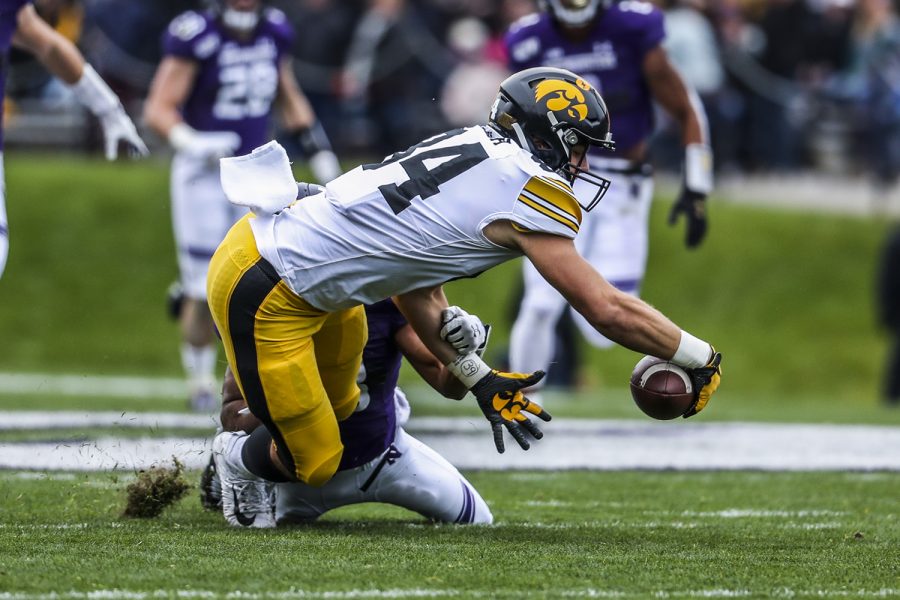 Iowa tight end Sam LaPorta dives after losing his grip on the ball during the Iowa vs. Northwestern football game at Ryan Field on Saturday, October 26, 2019. The Hawkeyes defeated the Wildcats 20-0. The pass was later ruled incomplete.