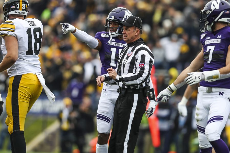 Northwestern defensive back A.J. Hampton discusses a play with the referee during the Iowa vs. Northwestern football game at Ryan Field on Saturday, October 26, 2019. The Hawkeyes defeated the Wildcats 20-0.