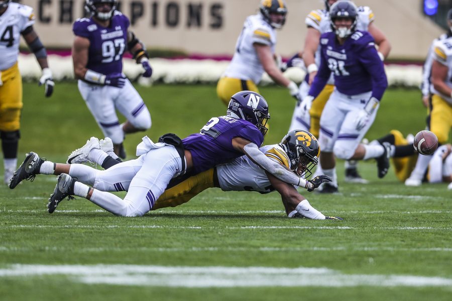 Northwestern defensive back A.J. Hampton blocks a pass thrown to Iowa running back Tyrone Tracy Jr., during the Iowa vs. Northwestern football game at Ryan Field on Saturday, October 26, 2019. The Hawkeyes defeated the Wildcats 20-0.