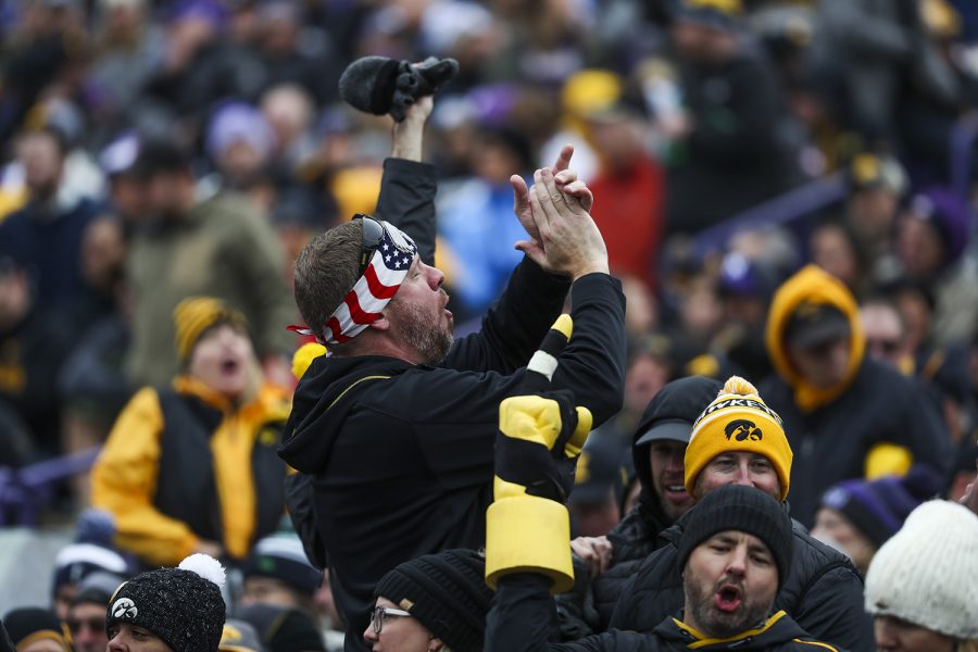A fan cheers after Iowa scores a touchdown, made by running back Mekhi Sargent, during the Iowa vs. Northwestern football game at Ryan Field on Saturday, October 26, 2019. The Hawkeyes defeated the Wildcats 20-0. Sargent scored one rushing touchdown during the 3rd quarter.