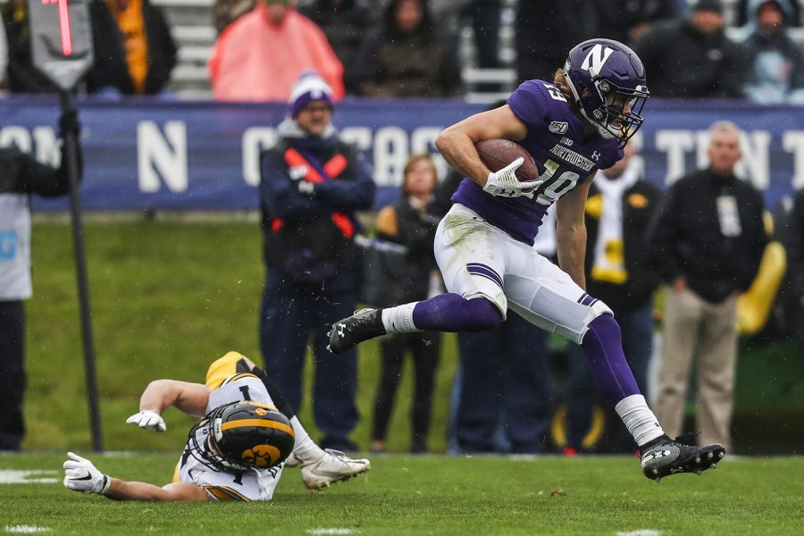 Northwestern wide receiver Riley Lees carries the ball during the Iowa vs. Northwestern football game at Ryan Field on Saturday, October 26, 2019. The Hawkeyes defeated the Wildcats 20-0. Lees caught two punt returns and gained 12 yards.