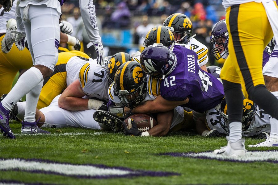 Iowa running back Mekhi Sargent scores a touchdown during the Iowa vs. Northwestern football game at Ryan Field on Saturday, October 26, 2019. The Hawkeyes defeated the Wildcats 20-0. Sargent carried the ball 46 yards, with the longest run at 13 yards.