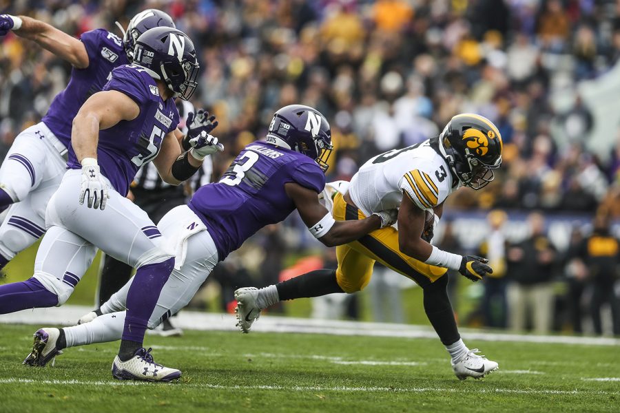 Iowa wide receiver Tyrone Tracy, Jr. carries the ball during the Iowa vs. Northwestern football game at Ryan Field on Saturday, October 26, 2019. The Hawkeyes defeated the Wildcats 20-0. Tracy caught 2 passes and gained a total of 88 yards.