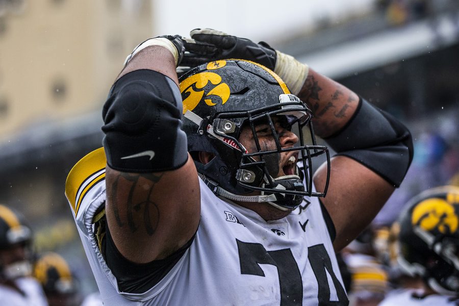 Iowa offensive lineman Tristan Wirfs cheers during the Iowa vs. Northwestern football game at Ryan Field on Saturday, October 26, 2019. The Hawkeyes defeated the Wildcats 20-0.