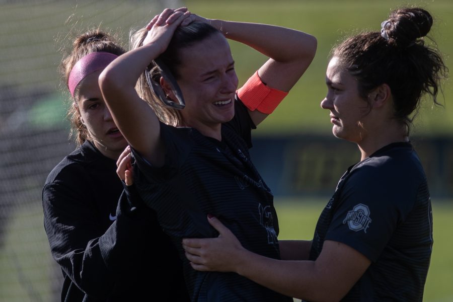 Ohio State players console defender Marine Mousset following the Iowa versus Ohio State game at the University of Iowa Soccer Complex on Sunday, October 27, 2019. The Hawkeyes defeated the Buckeyes 2-1 in double overtime. 
