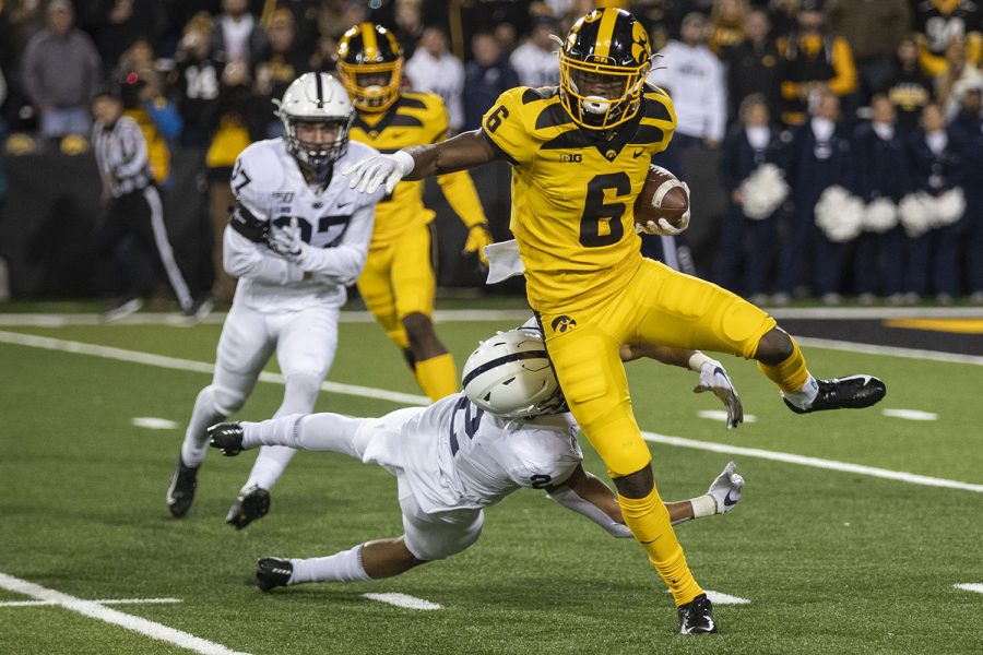 Iowa+WR+Ihmir+Smith-Marsette+jumps+a+defender+during+the+Iowa+football+vs.+Penn+State+game+in+Kinnick+Stadium+on+Saturday%2C+Oct.+12%2C+2019.+The+Nittany+Lions+defeated+the+Hawkeyes+17-12.+