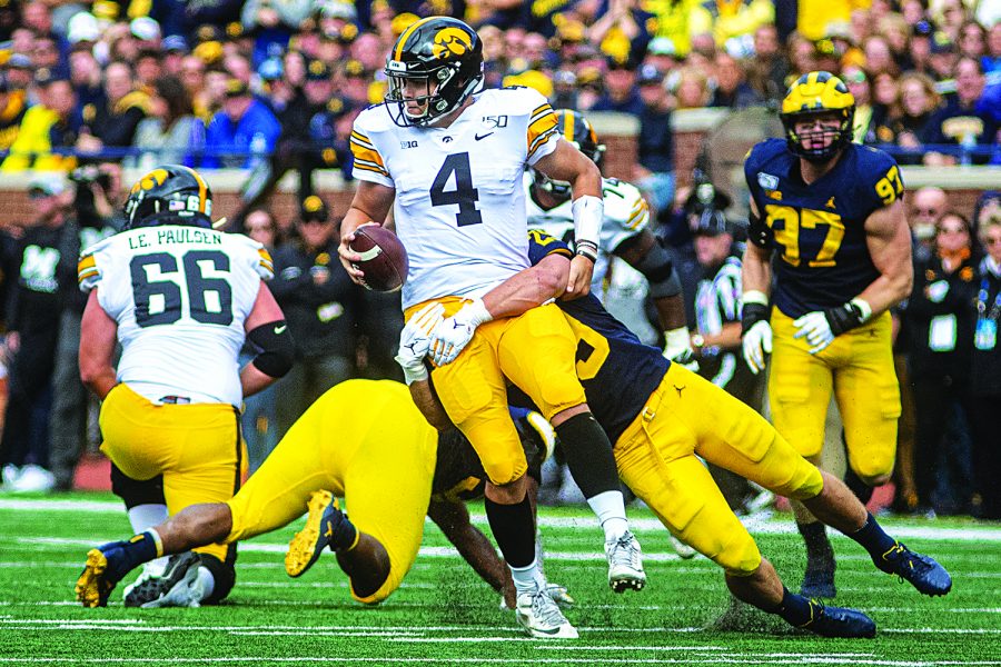 Michigan linebacker Jordan Glasgow sacks Iowa quarterback Nate Stanley during a football game between Iowa and Michigan in Ann Arbor on Saturday, October 5, 2019. The Wolverines celebrated homecoming and defeated the Hawkeyes, 10-3.