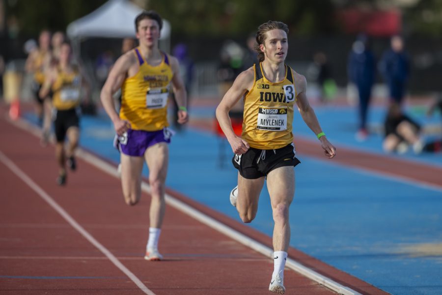 Iowa distance runner Nathan Mylenek leads the pack of the 1500-meter run at the Musco Twilight Invitational at the Cretzmeyer Track on Saturday, April 13, 2019. Mylenek won the race with a time 3:52:06. The Hawkeyes won 10 events during the meet. The Iowa women ranked first with 183 points, and the men ranked fifth 76 points. 