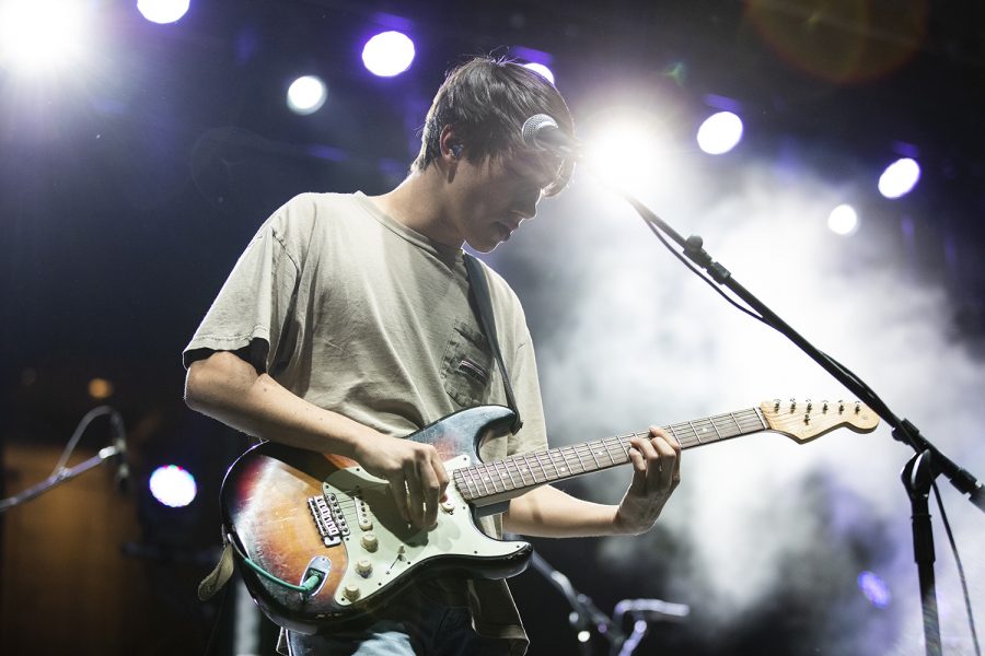 Underneath the lights, guitarist for The Greeting Company, the opening act for Bad Suns, concentrates on the music. The free concert was hosted by Scope Productions and was headlined by the band Bad Suns on October 18, 2019.