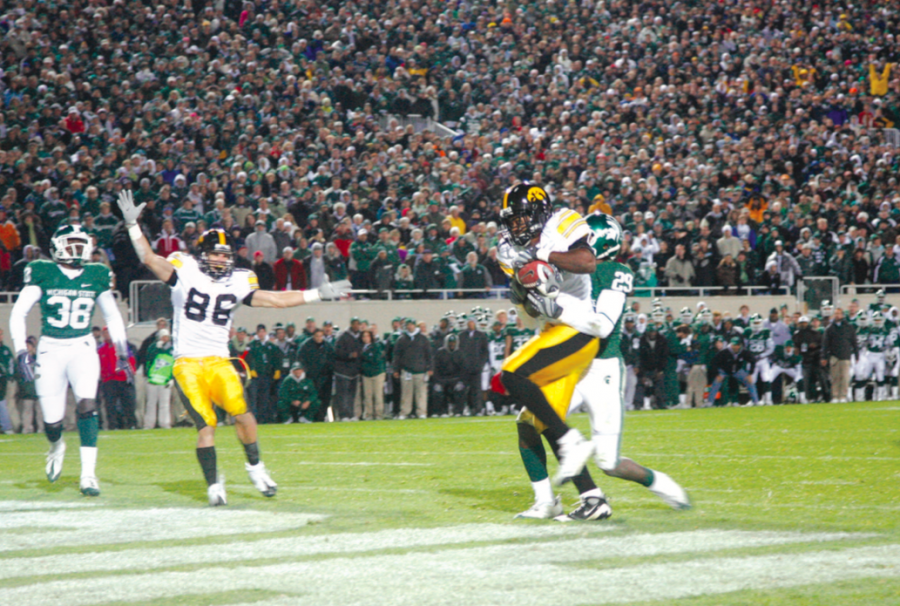 With two seconds left on the clock going into the play, Iowa wide receiver Marvin McNutt catches a 7-yard touchdown pass from Iowa quarterback Ricky Stanzi to win the game against Michigan State on Oct. 24 in East Lansing. The 15-13 victory gave the Hawkeyes an 8-0 record for the first time in school history.