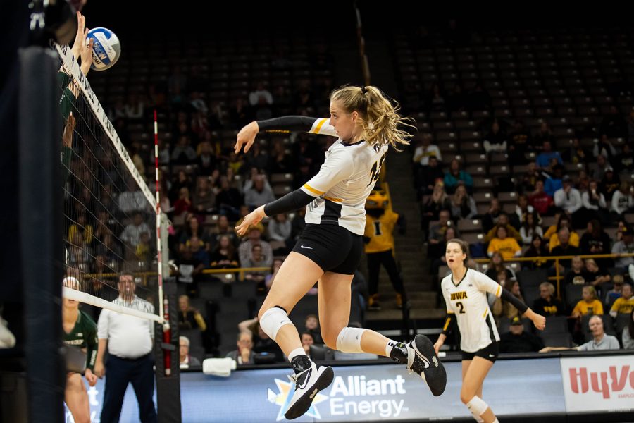 Iowa middle blocker Hannah Clayton spikes the ball during a volleyball match between Iowa and Michigan State at Carver Hawkeye Arena on Sunday, October 12, 2019. The Hawkeyes were defeated after 5 sets. 