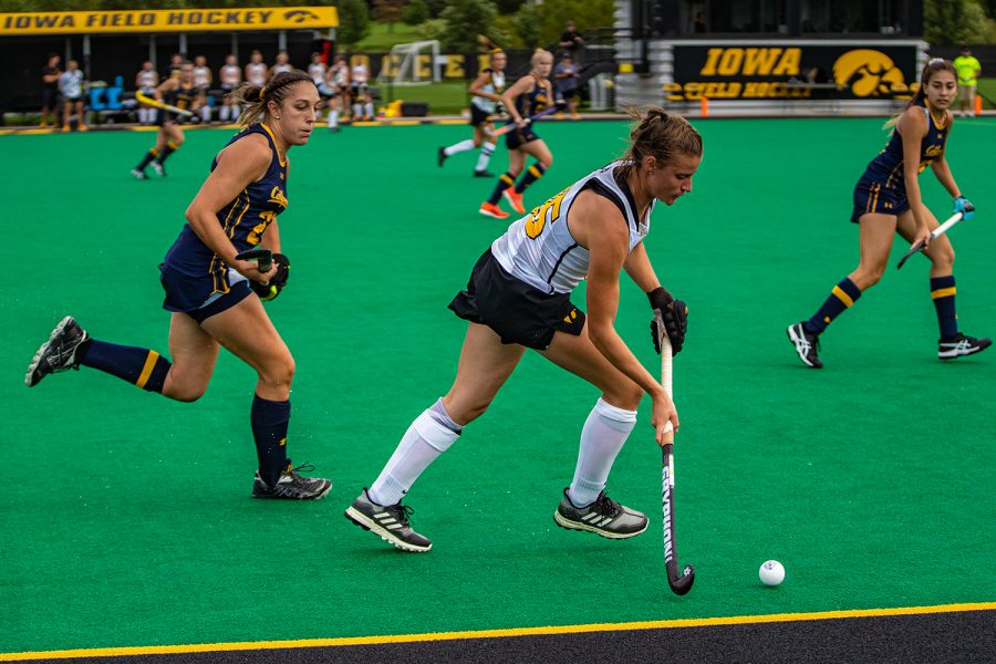 Iowa defender Esme Gibson makes a pass during a field hockey match between Iowa and California on Friday, September 13, 2019. The Hawkeyes defeated the Bears, 4-2. (Shivansh Ahuja/The Daily Iowan)
