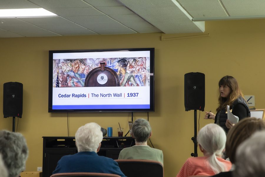 Stanley Museum of Art Senior Living Communities Program Coordinator Amanda Lensing discusses Francis R. White’s Cedar Rapids Murals with senior citizens at Melrose Meadows Retirement Community on Thursday, October 24th, 2019. Lensing’s presentation focused on murals built in the US midwest after the New Deal in the 1930s. 