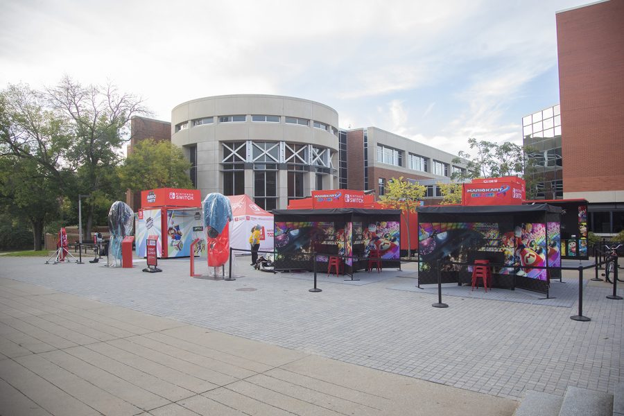 A student security worker guards the Nintendo Switch Together tour event space on the Main Library Plaza on Thursday, Oct. 3, 2019.