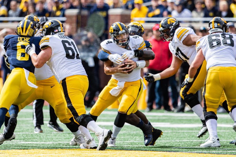 Iowa+quarterback+Nate+Stanley+falls+to+the+turf+during+a+football+game+between+Iowa+and+Michigan+in+Ann+Arbor+on+Saturday%2C+October+5%2C+2019.+