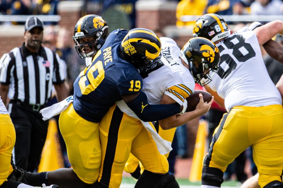 Michigan defensive lineman Kwity Paye sacks Iowas Nate Stanley during a football game between Iowa and Michigan in Ann Arbor on Saturday, October 5, 2019. The Wolverines celebrated homecoming and defeated the Hawkeyes, 10-3.