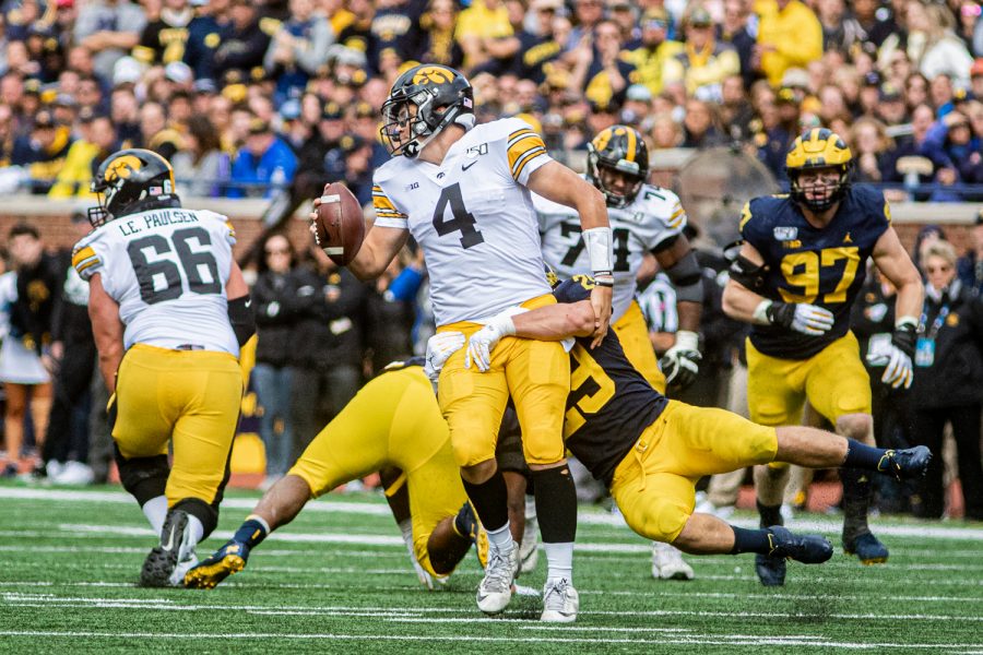 Michigan linebacker Jordan Glasgow sacks Iowa quarterback Nate Stanley during a football game between Iowa and Michigan in Ann Arbor on Saturday, October 5, 2019. The Wolverines celebrated homecoming and defeated the Hawkeyes, 10-3.