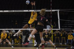 Iowa outside hitter Griere Hughes blocks the ball during a volleyball game between Iowa and Rutgers at the Carver Hawkeye Arena on Nov. 2, 2019. The Hawkeyes fell to the Scarlet Knights, 0-3.