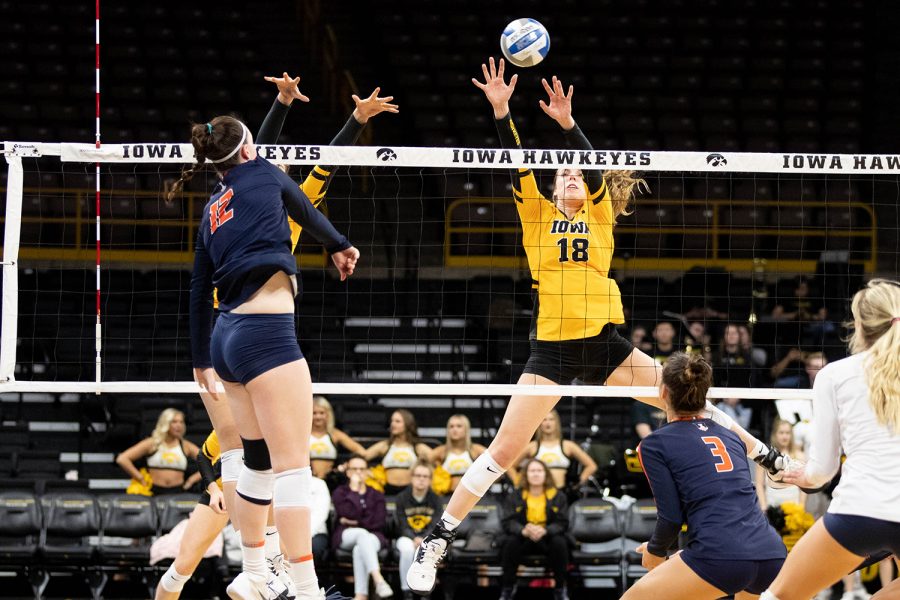 Iowas Hannah Clayton blocks a spike from Illinois Ashlyn Fleming during a match University of Illinois on Wednesday, Nov. 6, 2019. The Hawkeyes lost to the Fighting Illini, who won 3-0. 
