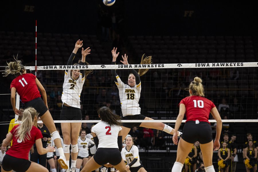 Courtney Buzzerio and Hannah Clayton try to stop the Huskers from scoring during the Iowa and Nebraska volleyball game. The Huskers defeated the Hawkeyes in three sets on November 9, 2019, at Carver-Hawkeye Arena. 
