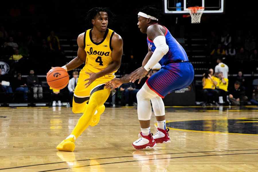Iowa guard Bakari Evelyn drives down the middle during a game against Depaul at Carver Hawkeye Arena on Monday, November 11, 2019. The Hawkeyes were defeated by the Blue Demons 93-78. Evelyn had 3 of the teams 12 assists.