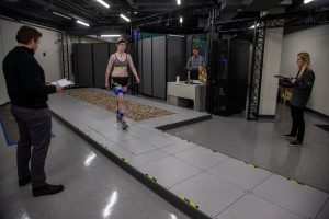PhD student Kirsten Anderson walks across the lab during a computerized gait analysis on Thursday, Nov. 14, 2019. The small spheres attached to her body are sensors that cameras see to make a computer-generated figure. 