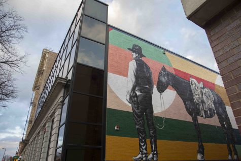A mural by Thomas Agran depicting Ben S. Summerwill is seen on the wall of the MidwestOne Bank in downtown Iowa City on Tuesday, 19 November, 2019.