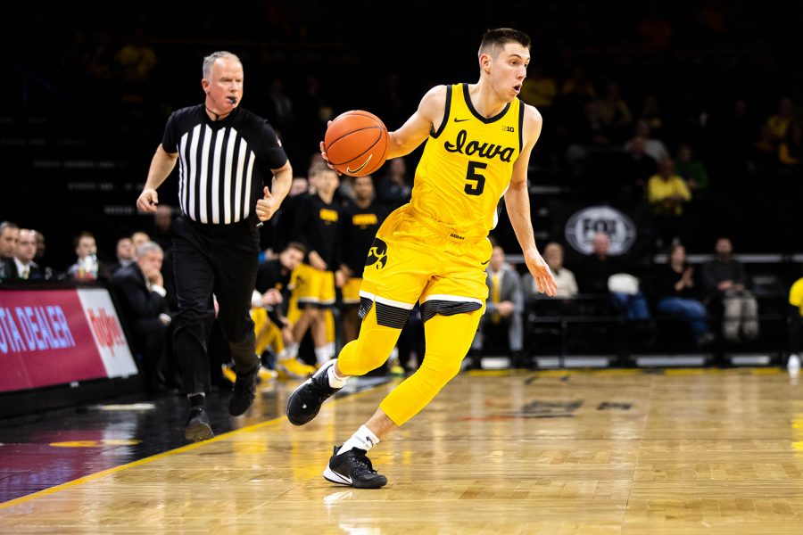 Iowa guard CJ Frederick drives down the court during a game against Depaul at Carver Hawkeye Arena on Monday, November 11, 2019. The Hawkeyes were defeated by the Blue Demons, 93-78. 