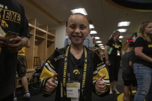 Kid Captain Skylar Hardee signals a thumbs up in the Hawkeye football locker room at Kids Day at Kinnick on Saturday, August 10, 2019. Kids Day at Kinnick is an annual event for families to experience Iowas football stadium, while watching preseason practice and honoring this years Kid Captains.