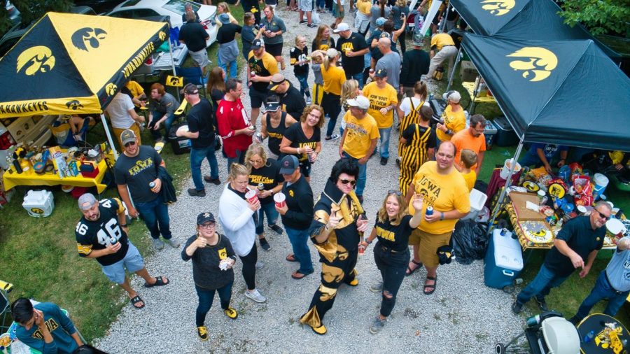 Greg Suckow, known as Hawkeye Elvis, tailgates with friends he met through Twitter.