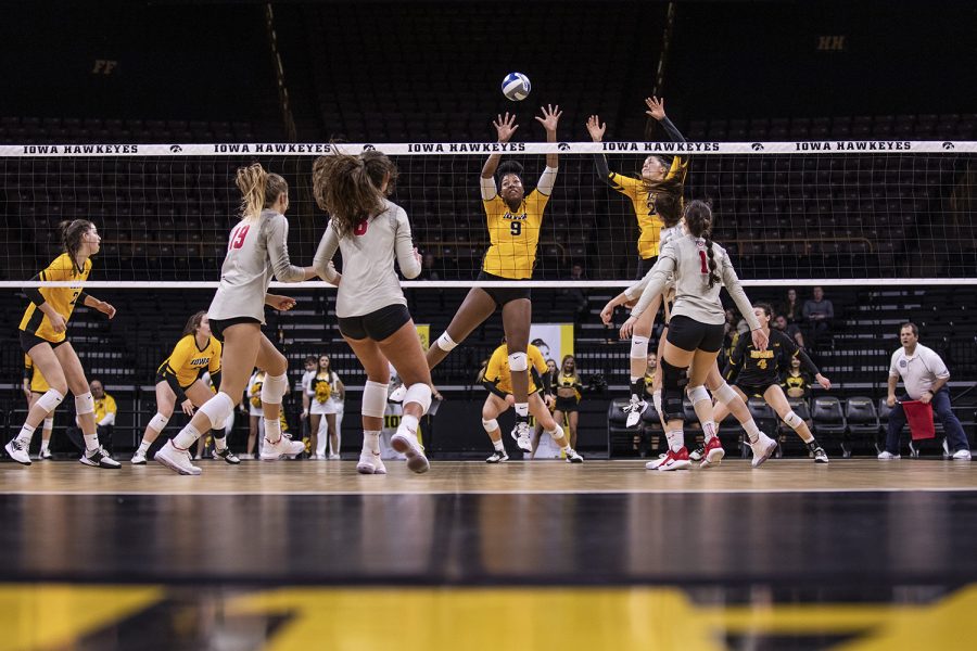 Iowa middle blocker Amiya Jones and Iowa outside hitter Edina Schmidt prepare to block the ball during a volleyball match between the University of Iowa and Ohio State University at Carver Hawkeye Arena on Friday, November 29, 2019. The Buckeyes defeated the Hawkeyes 3-1.