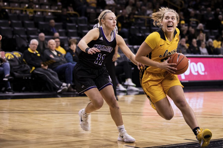 Iowa Guard Kathleen Doyle sets up a shot during a Women's basketball exhibition game between the University of Iowa and Winona State University at Carver Hawkeye Arena on November 3, 2019. The Hawkeye's beat the Warrior's with a score of  98-53.