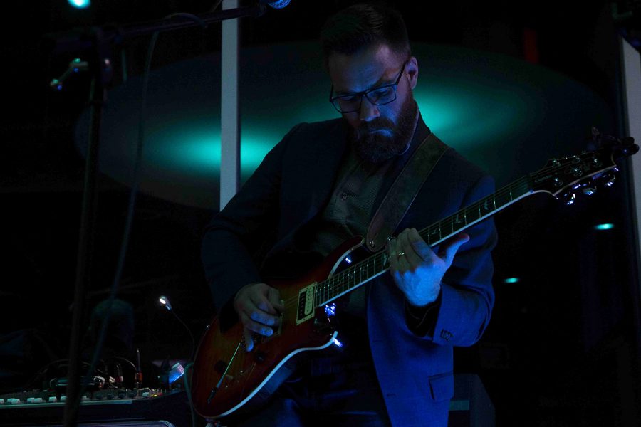 Musician Micah Goebel plays the guitar during a performance by the band Vintage at the Vue Rooftop on Saturday, Nov. 16, 2019. Vintage regularly plays American classic rock hits including “Brown Eyed Girl” by Van Morrison and “Take it Easy” by The Eagles. 