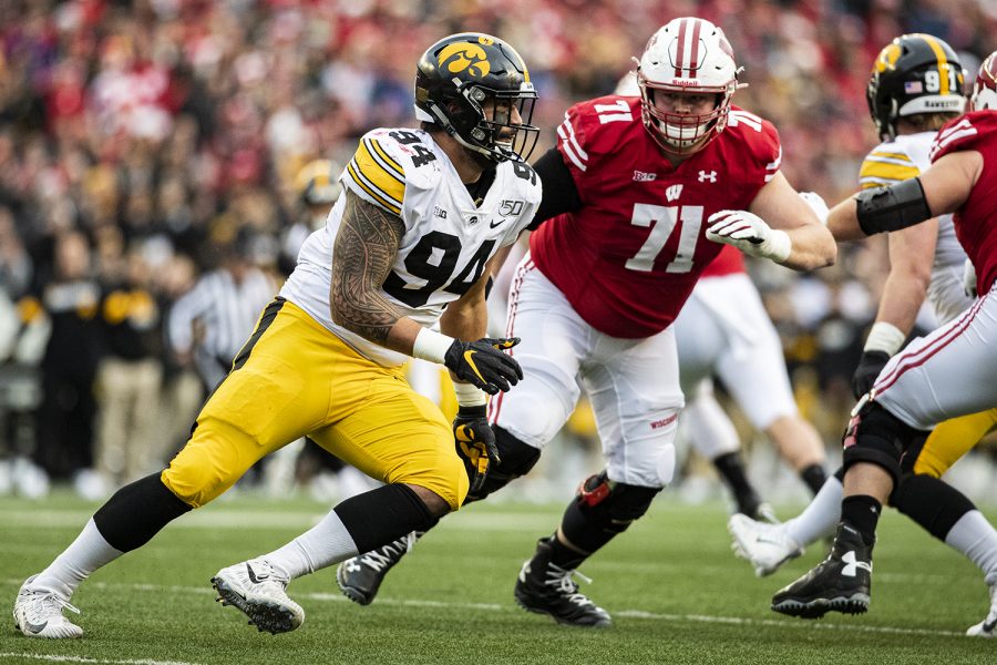 Iowa defensive end AJ Epenesa rushes the passer during a football game between Iowa and Wisconsin at Camp Randall Stadium in Madison on Saturday, November 9, 2019.