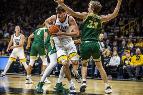 Iowa center Luka Garza drives the ball during the mens basketball game against Cal Poly at Carver-Hawkeye Arena on Sunday, November 24, 2019. 
