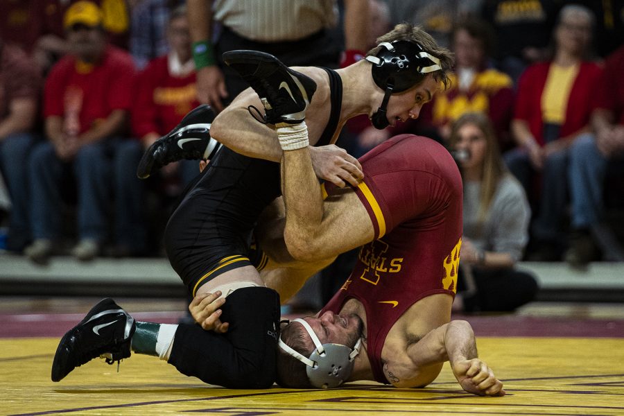 Iowas 125-pound Spencer Lee wrestles Iowa States Alex Mackall during a dual meet in Ames on Sunday, November 24, 2019. Lee won by technical fall, 17-2, and the Hawkeyes defeated the Cyclones, 29-6.