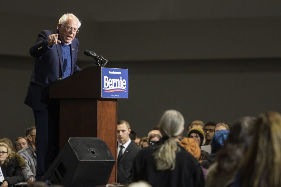 Sen. Bernie Sanders, I-Vt, and Rep. Alexandria Ocasio-Cortez, D-N.Y, exit the stage after a rally at the Coralville Marriott Hotel and Conference Center on Saturday, Nov. 9, 2019. Sen. Sanders and Rep. Osasio-Cortez spoke on climate change and women’s rights.