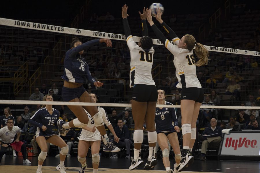 Iowa+outside+hitter+Griere+Hughes+and+middle+blocker+Hannah+Clayton+jump+for+a+block+during+a+volleyball+game+against+Penn+State+on+Nov.+1%2C+2019+at+Carver+Hawkeye+Arena.+The+Hawkeyes+fell+to+the+Lions%2C+0-3.+%28Hannah+Kinson%2FThe+Daily+Iowan%29
