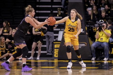Iowa Forward Monika Czinano attempts to steal the ball during a Womens basketball exhibition game between the University of Iowa and Winona State University at Carver Hawkeye Arena on November 3, 2019. The Hawkeyes beat the Warriors with a score of  98-53. 